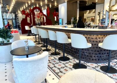 a bar with chairs and tables